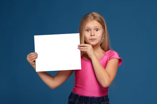 Portrait of adorable emotional little girl on blue background photo