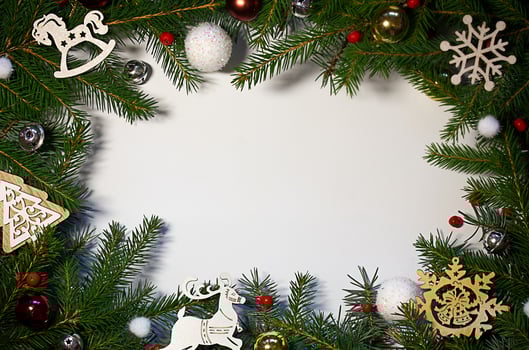 Creative composition with green spruce branches on a white background. Christmas background in retro style. New Year and Christmas holiday card. Nature New Year concept. photo