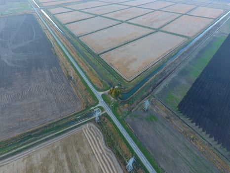 Crossroads paved roads through the fields. View from above photo