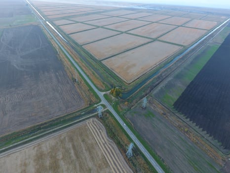 Crossroads paved roads through the fields. View from above photo