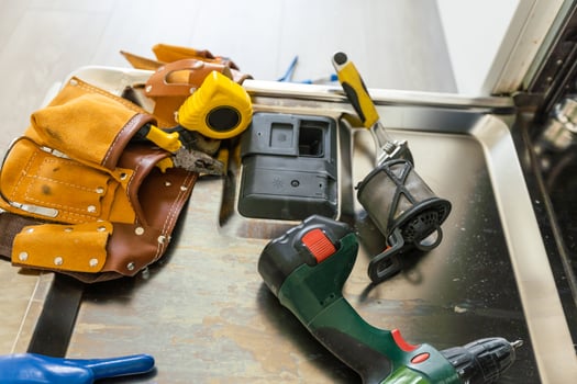 repairing a dishwasher with tools photo