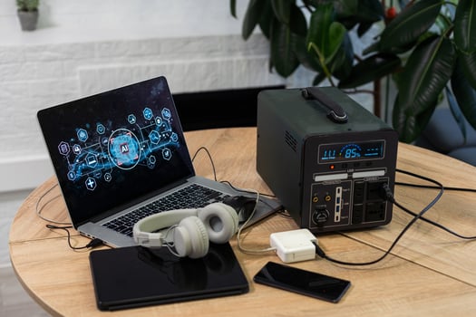Portable power station solar electricity generator laptop, phone, tablet and digital camera electronic devices charging. Wireless charging battery backup, power outage emergencies outdoors, camping photo