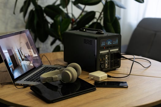 Portable power station solar electricity generator laptop, phone, tablet and digital camera electronic devices charging. Wireless charging battery backup, power outage emergencies outdoors, camping photo