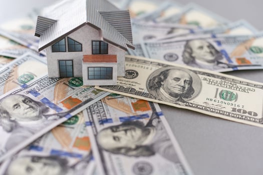 Small Model House on Newly Designed U.S. One Hundred Dollar Bills. photo