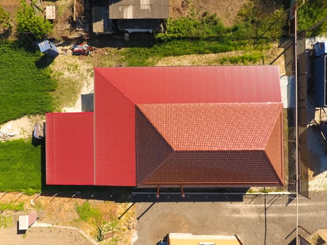A house with a canopy over the courtyard. Roof from corrugated metal profile. Metal tiles. photo