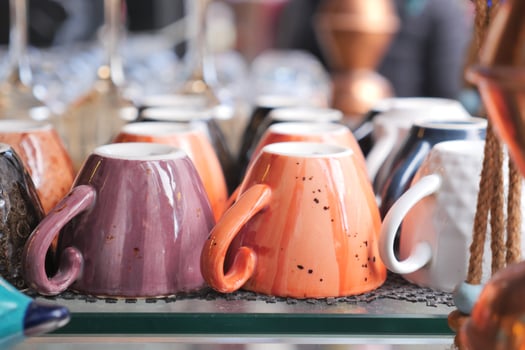 colorful coffee cup lined up on a coffee machine at cafe . photo