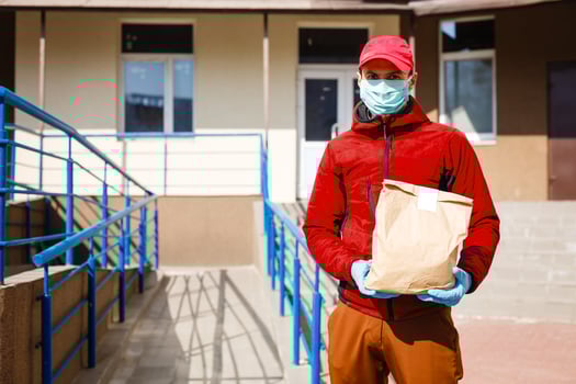 food delivery man Wearing Medical Mask. Corona Virus Concept photo