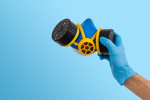 Man hand with plastic glove hold a protective virus ffp2 mask,coronavirus covid photo