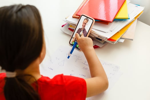 Distance learning online education, little girl writes formulas photo