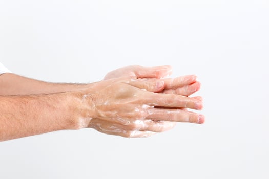 Close up image of washing hand against white background photo