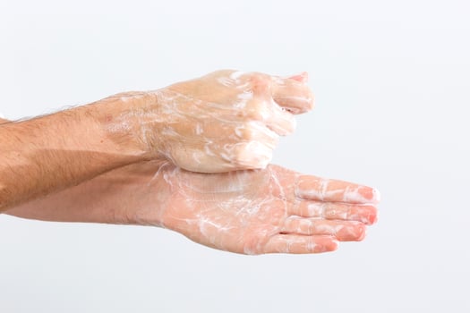 man washing hands isolated over white background photo