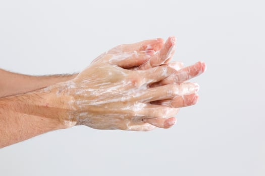 man washing hands isolated over white background photo