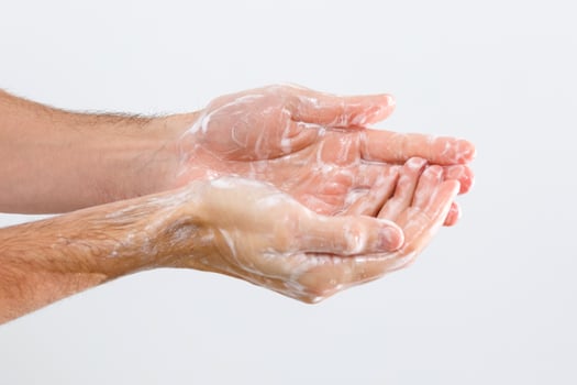 man washing hands isolated over white background photo