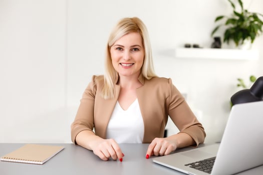 Woman working at home on a laptop computer photo