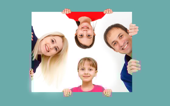 family holds holds photo canvas at home