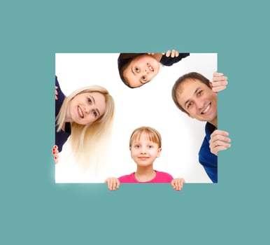 family holds holds photo canvas at home