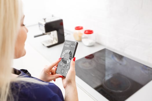 Smart Home Device-Home Management. Woman presses the virtual button photo