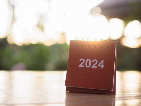 Close up 2024 desk calendar on the table with copy space. Resolution, Goal, Action, Planning, and manage to success business. photo