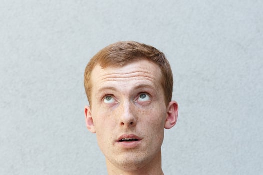 Close up portrait of a redhead of a beautiful manly guy with freckles photo