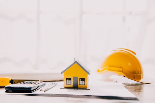 architect man working with laptop and blueprints,engineer inspection in workplace for architectural plan,sketching a construction project ,selective focus,Business concept vintage color photo