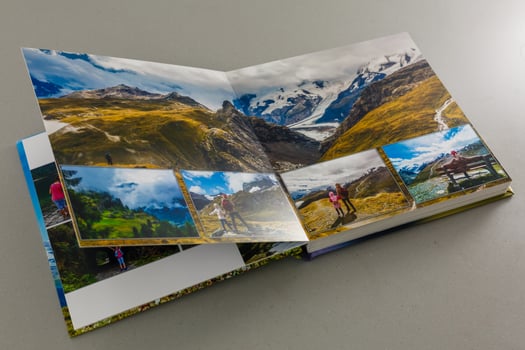 open photo book on a gray background