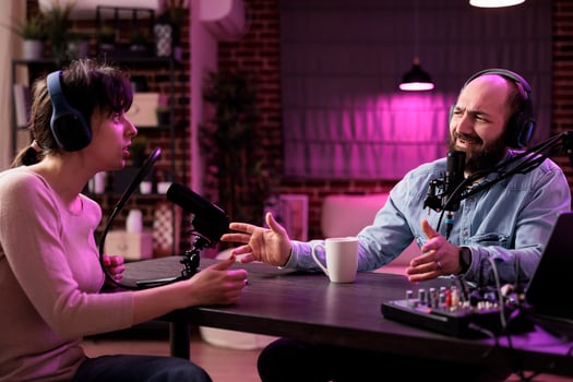 Show host interviewing woman during live stream, talking about fashion and style trends, disagreeing with her opinions. Man arguing with social media celebrity, recording podcast photo