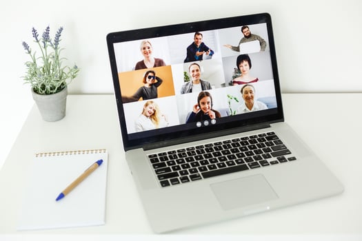 Back view of female employee speak talk on video call with diverse multiracial colleagues on online briefing, woman worker have Webcam group conference with coworkers on modern laptop at home photo