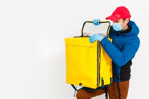 delivery man send food bag at door knob for contactless or contact free from delivery rider in front house for social distancing for infection risk. photo
