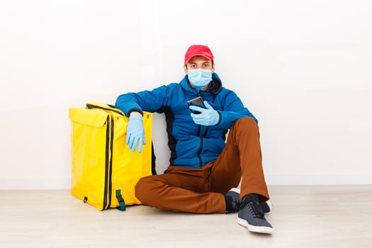 delivery man send food bag at door knob for contactless or contact free from delivery rider in front house for social distancing for infection risk. photo