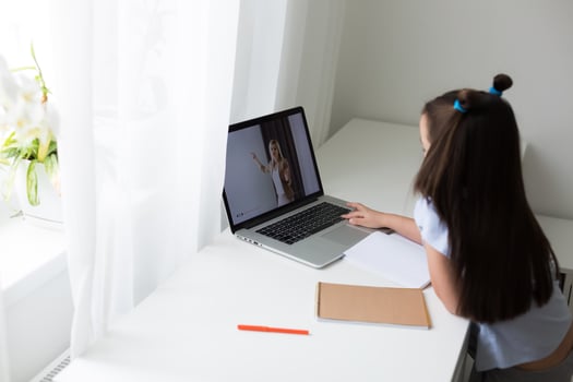 little girl studying with laptop online learning photo