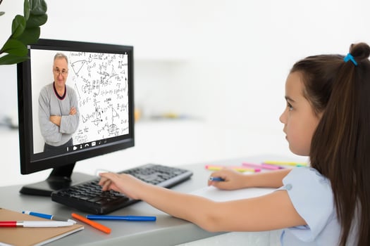 Pretty stylish schoolgirl studying homework math during her online lesson at home, social distance during quarantine, self-isolation, online education concept, home schooler photo