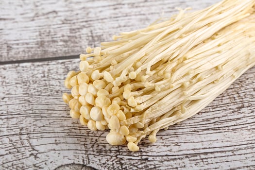 Tasty raw enoki mushroom heap photo