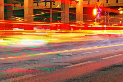Roving car with blur light through city at night photo