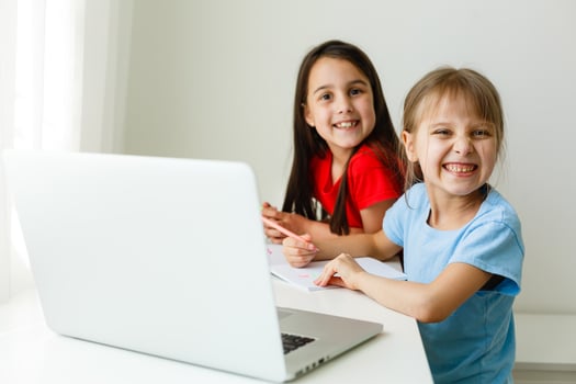 Pretty stylish schoolgirls studying math during her online lesson at home, social distance during quarantine, self-isolation, online education concept photo