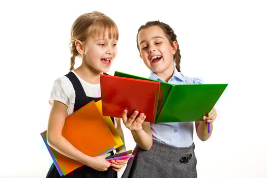 Two little schoolgirls. Education, fashion, friendship concept. photo