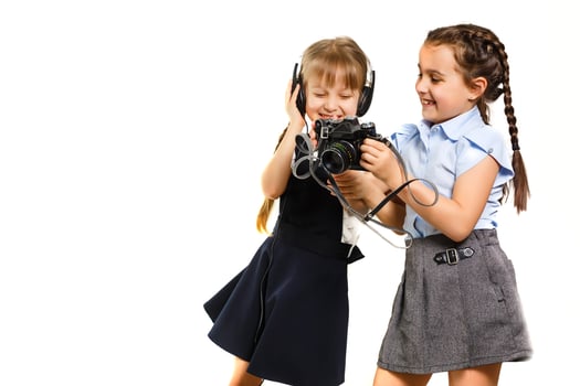 two little schoolgirls at recess. Children enjoy this recess. They smile fun. photo