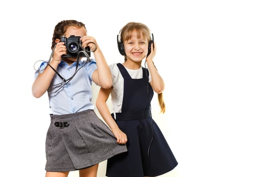 two little schoolgirls at recess. Children enjoy this recess. They smile fun. photo
