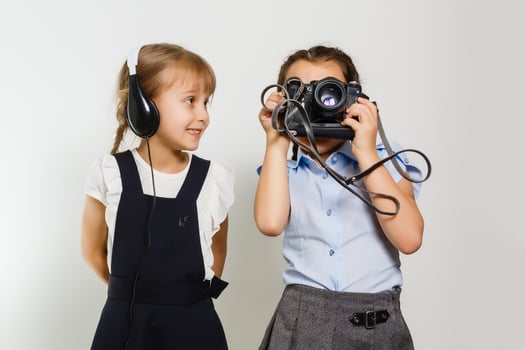 Two adorable little schoolgirls for a break photo
