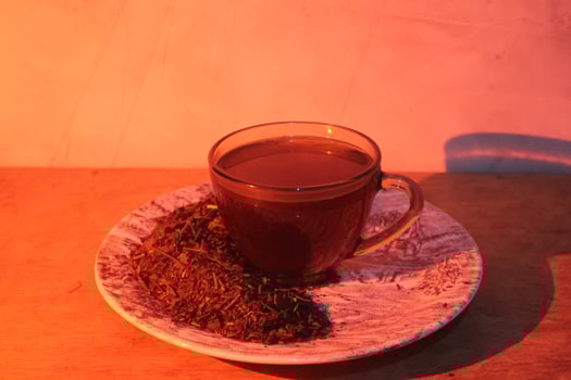 The tea is served on a glass plate and is arranged with the tea powder itself. photo