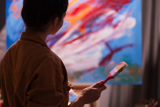 Artist admiring latest masterpiece in art workshop. Modern artwork paint on canvas, creative, contemporary and successful fine art artist drawing masterpiece photo