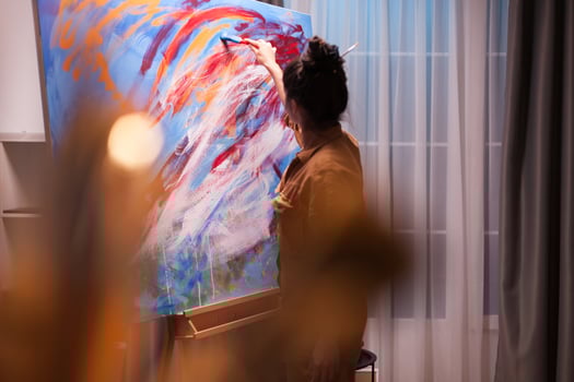 Painting a masterpiece in creative art workshop on canvas. Modern artwork paint on canvas, creative, contemporary and successful fine art artist drawing masterpiece photo