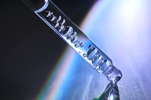 Pipette with serum in a space atmosphere. photo