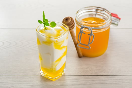 prepared homemade yogurt with natural honey in a glass photo