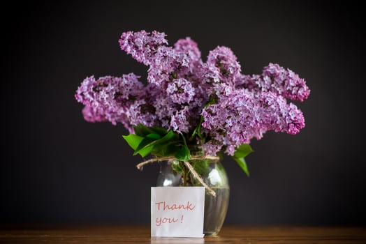 bouquet of beautiful spring flowers of lilac on the table photo