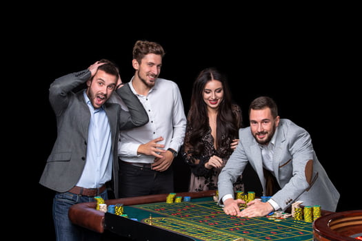 Upper class friends gambling in a casino. photo
