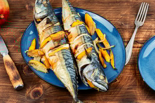 Grilled baked mackerel fish with mango. photo