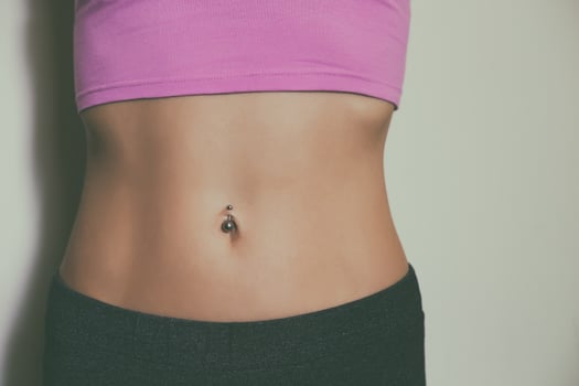 Close up stomach of a sporty woman with abs .Toned photo
