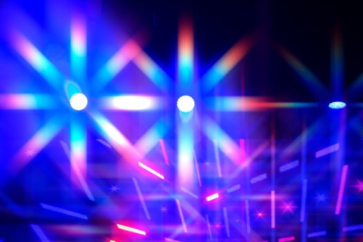 Bright multi-colored iridescent lights of stage lighting. Background scene, performance. Concert light. photo