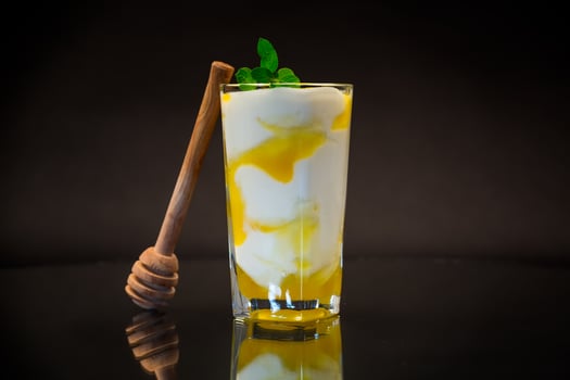prepared homemade yogurt with natural honey in a glass photo