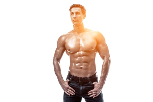 Muscular handsome young man with naked torso. Isolated on white photo
